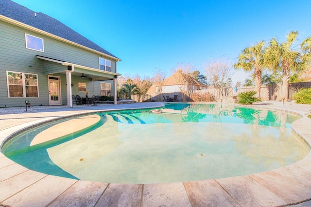 view of pool featuring ceiling fan and a patio