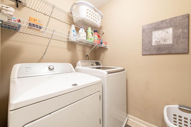 washroom with washer and clothes dryer