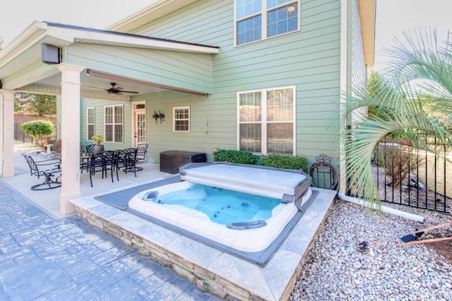 view of pool with ceiling fan and a patio area