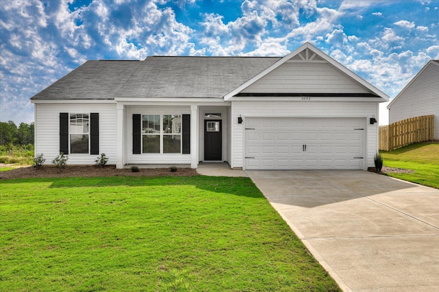 view of front of home featuring a front yard and a garage