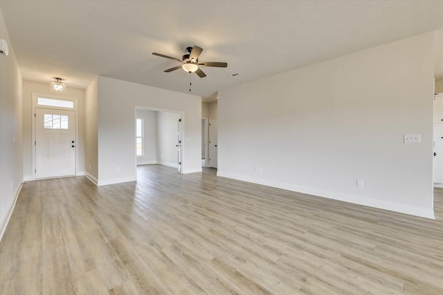 unfurnished living room featuring ceiling fan and light hardwood / wood-style flooring