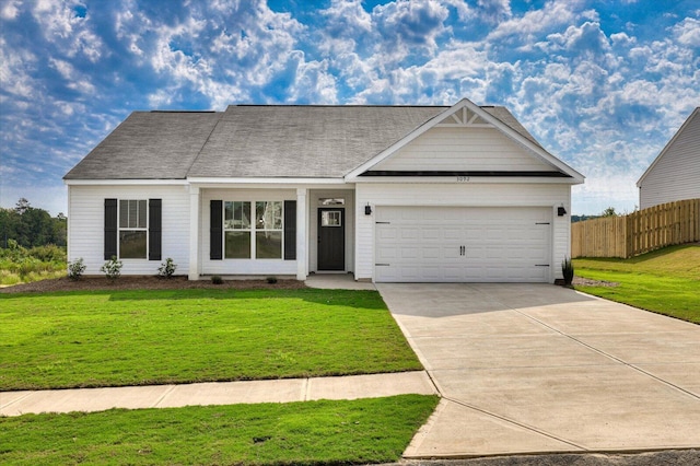 view of front of home with a garage and a front yard