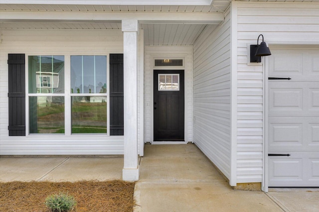 view of exterior entry featuring a porch