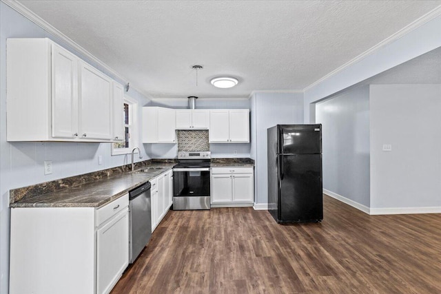 kitchen with stainless steel appliances, ornamental molding, a textured ceiling, white cabinets, and sink