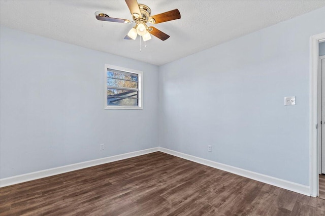 empty room featuring a textured ceiling, ceiling fan, and dark hardwood / wood-style floors