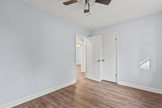 interior space with ceiling fan and hardwood / wood-style flooring