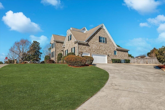 view of front facade featuring a garage and a front yard