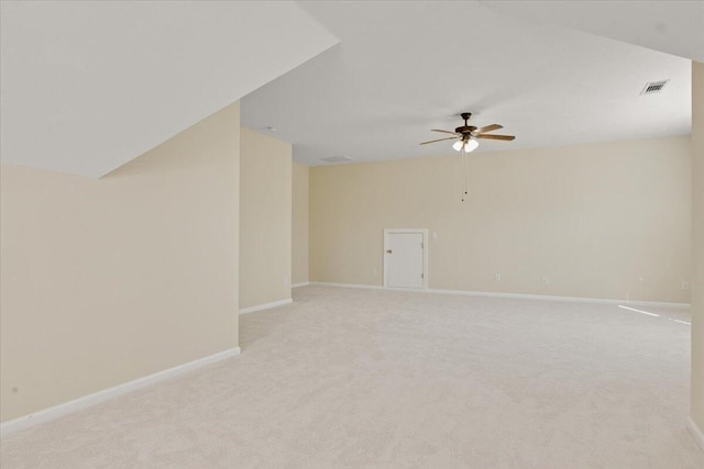 unfurnished room with ceiling fan and light colored carpet