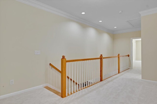 hall featuring crown molding and light colored carpet