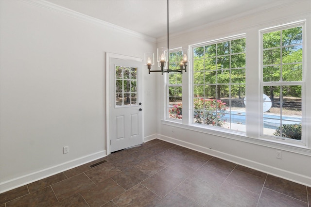 unfurnished dining area with a notable chandelier, baseboards, and plenty of natural light