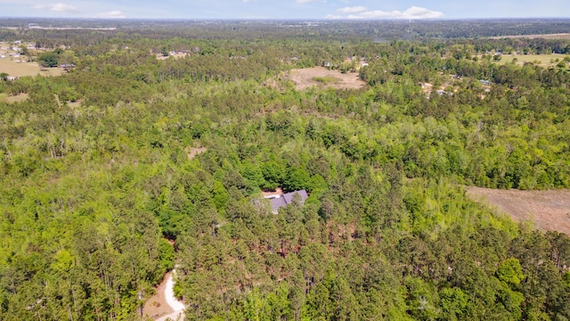bird's eye view featuring a forest view