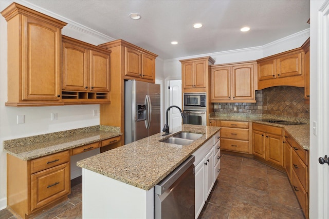 kitchen featuring light stone countertops, an island with sink, decorative backsplash, appliances with stainless steel finishes, and a sink