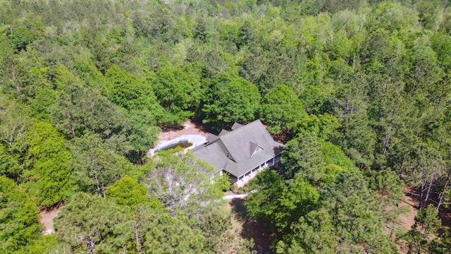 drone / aerial view featuring a forest view