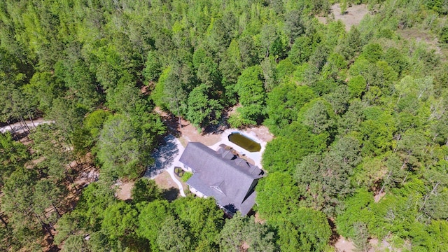 drone / aerial view with a view of trees