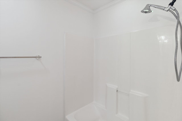 full bathroom featuring ornamental molding and a shower