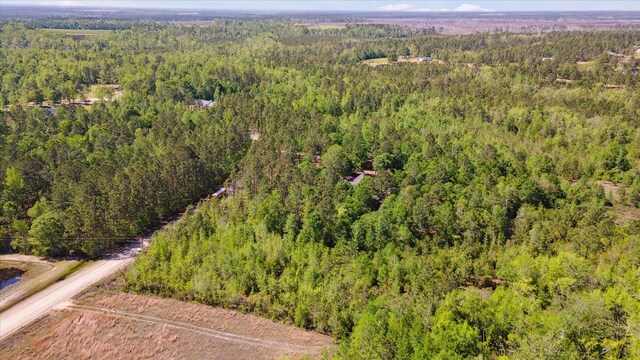 bird's eye view featuring a forest view