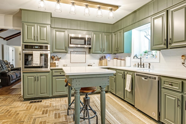 217 Longmeadow Rd, North Augusta, SC 29860 - kitchen with green cabinetry, appliances with stainless steel finishes, backsplash, light countertops, and brick patterned floors
