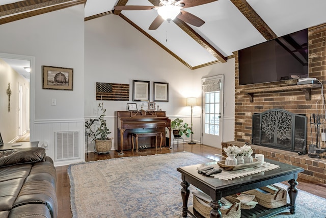 217 Longmeadow Rd, North Augusta, SC 29860 - living room featuring ceiling fan, a wainscoted wall, wood finished floors, high vaulted ceiling, and beamed ceiling