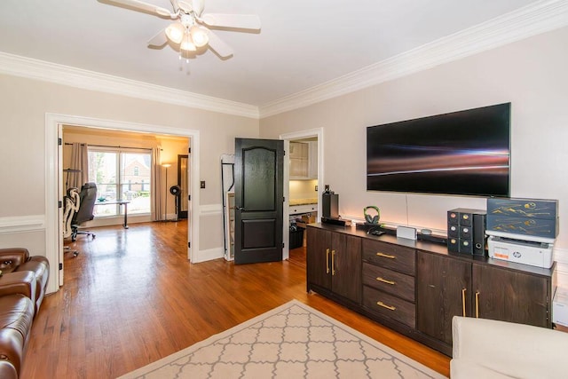 701 Fosters Ct, Evans, GA 30809 - living room with a ceiling fan, crown molding, dark wood-type flooring, a desk, and baseboards