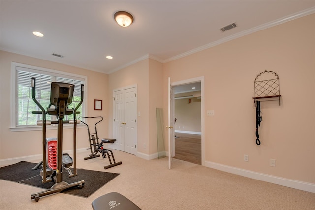 exercise room with light colored carpet, crown molding, visible vents, baseboards, and recessed lighting
