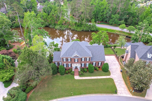 birds eye view of property with a water view