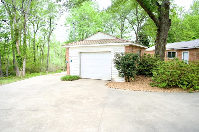 detached garage featuring driveway