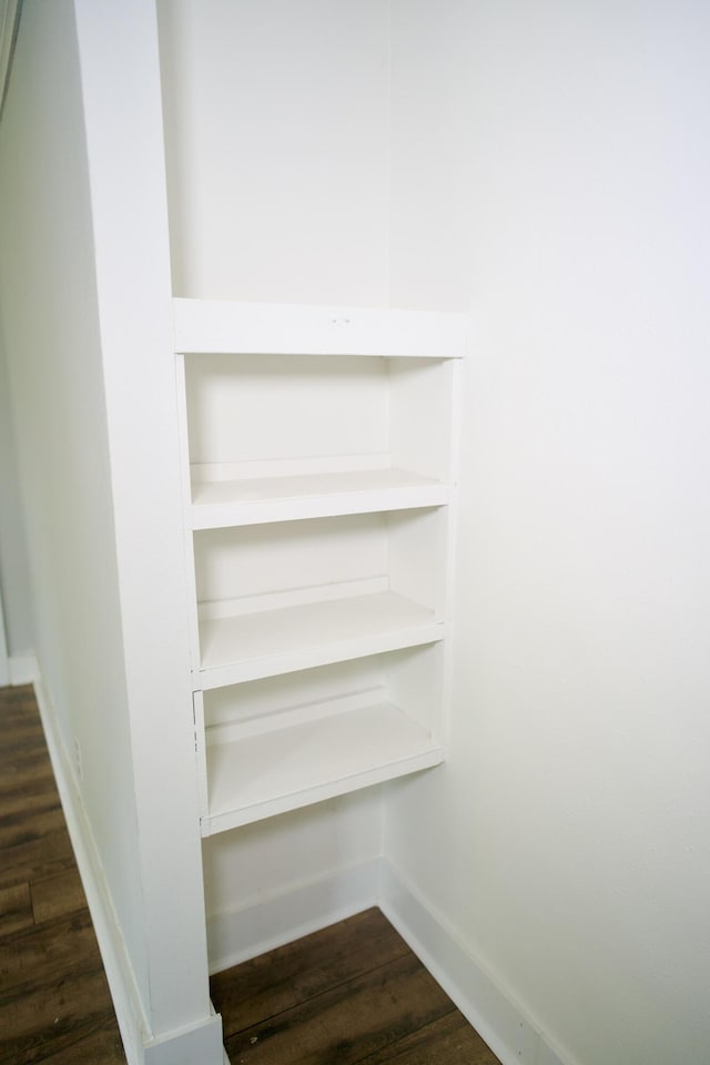 details featuring baseboards and wood finished floors