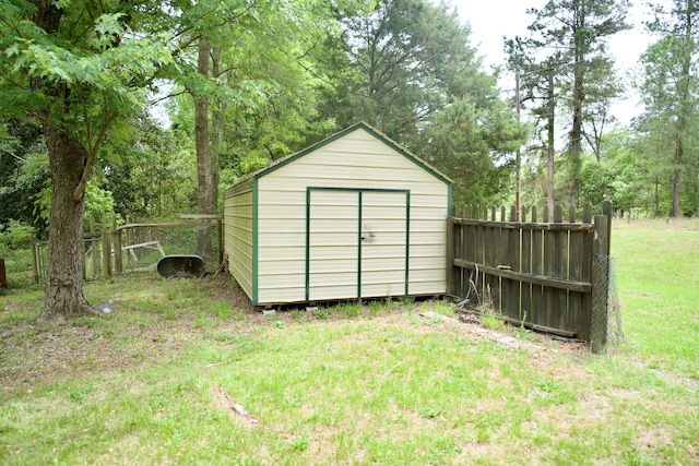 view of shed featuring fence