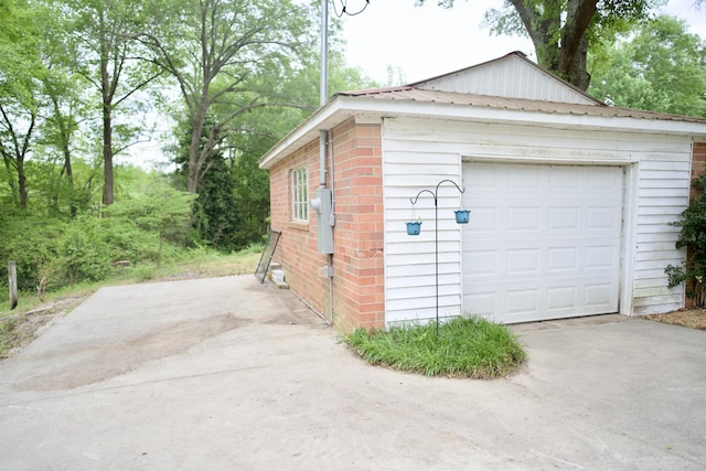 detached garage featuring driveway