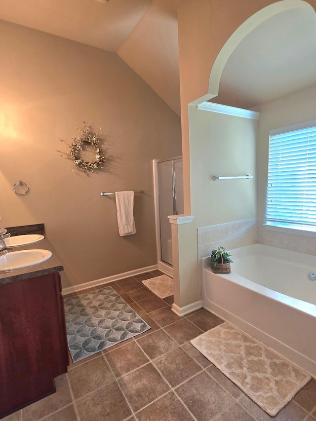 2144 Willhaven Dr, Augusta, GA 30909 - bathroom with a bath, a stall shower, double vanity, lofted ceiling, and tile patterned floors