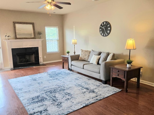 2144 Willhaven Dr, Augusta, GA 30909 - living room with a ceiling fan, dark wood-style flooring, and a fireplace with raised hearth