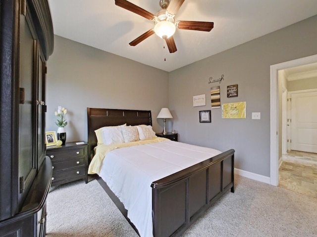 bedroom featuring ceiling fan and light colored carpet