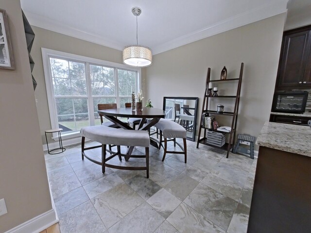 dining area featuring ornamental molding