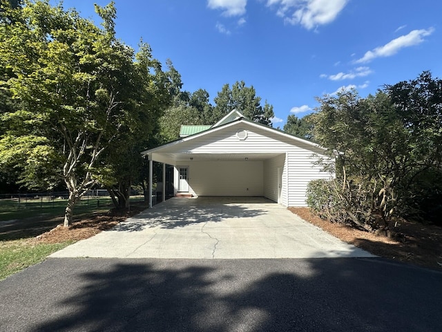 exterior space with a carport