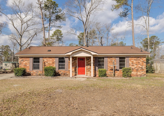 ranch-style home with a front yard