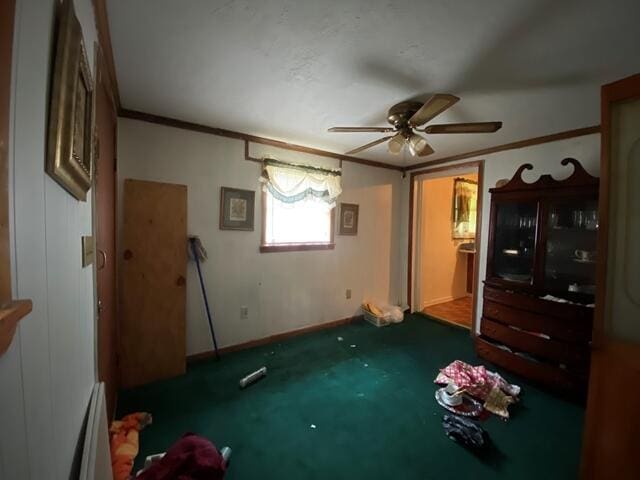 1012 14th Ave, Augusta, GA 30901 - unfurnished bedroom featuring crown molding, baseboards, carpet flooring, and a ceiling fan