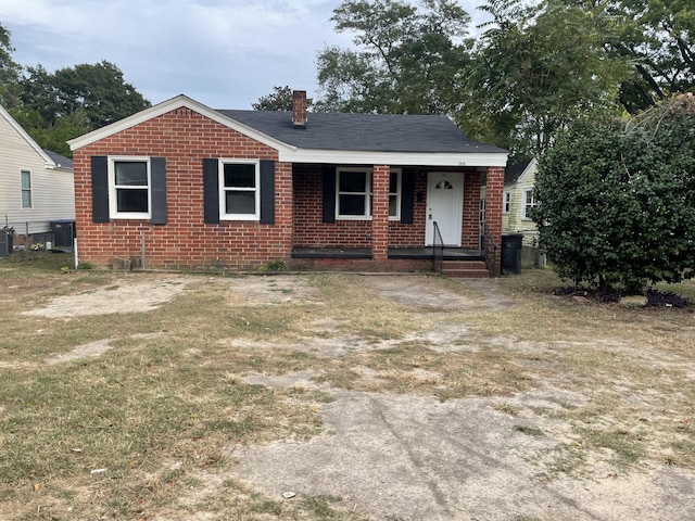 view of front of house with central AC unit and a porch