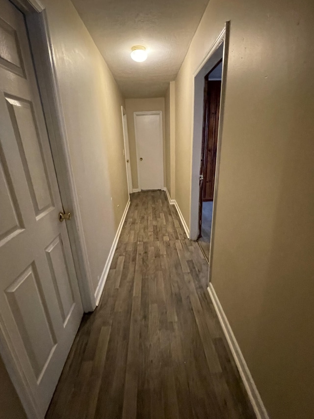 corridor featuring hardwood / wood-style floors