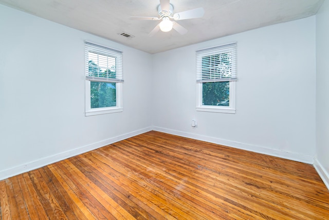 spare room featuring ceiling fan and wood-type flooring