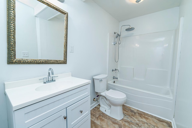 full bathroom featuring toilet, vanity, and washtub / shower combination