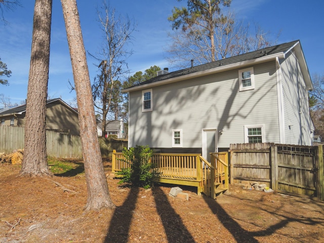 back of property with a deck