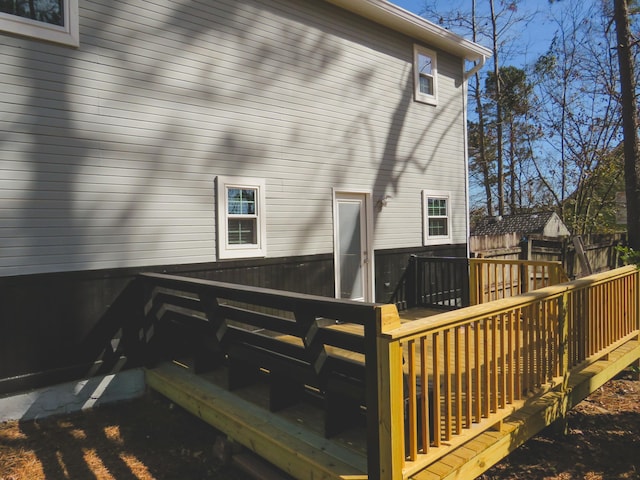 back of property with a wooden deck