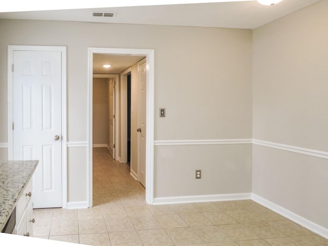 interior space with light tile patterned flooring