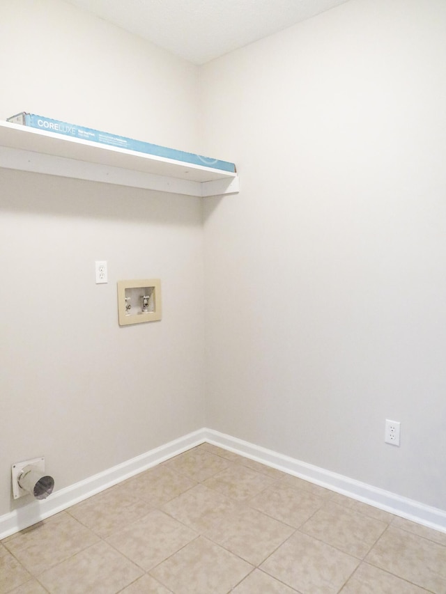 washroom with tile patterned flooring and washer hookup