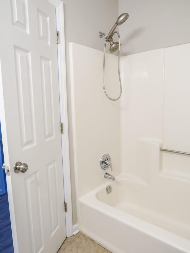 bathroom with shower / washtub combination