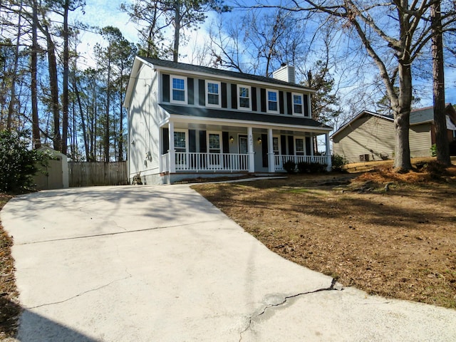 colonial home with a porch