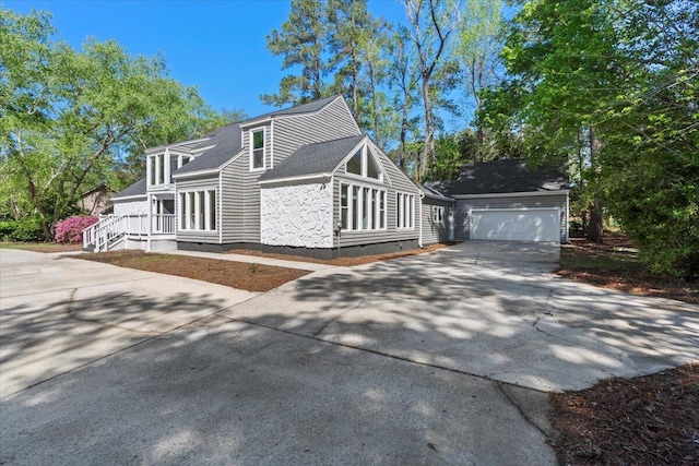 view of home's exterior with driveway and crawl space