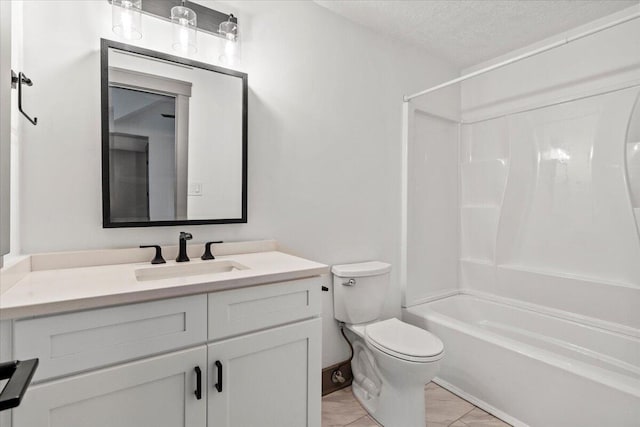 bathroom with toilet, vanity, shower / bathtub combination, and a textured ceiling