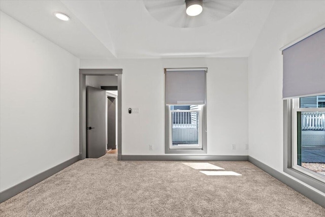 unfurnished bedroom featuring carpet floors, heating unit, baseboards, and recessed lighting