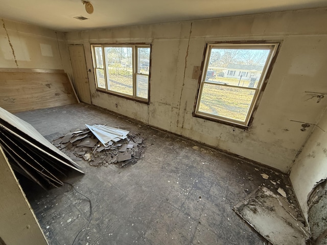 miscellaneous room with a healthy amount of sunlight and visible vents